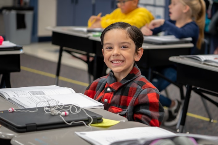 Student smiling in classroom 