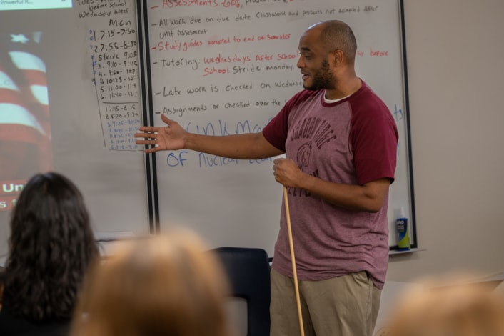 teacher speaking in front of class
