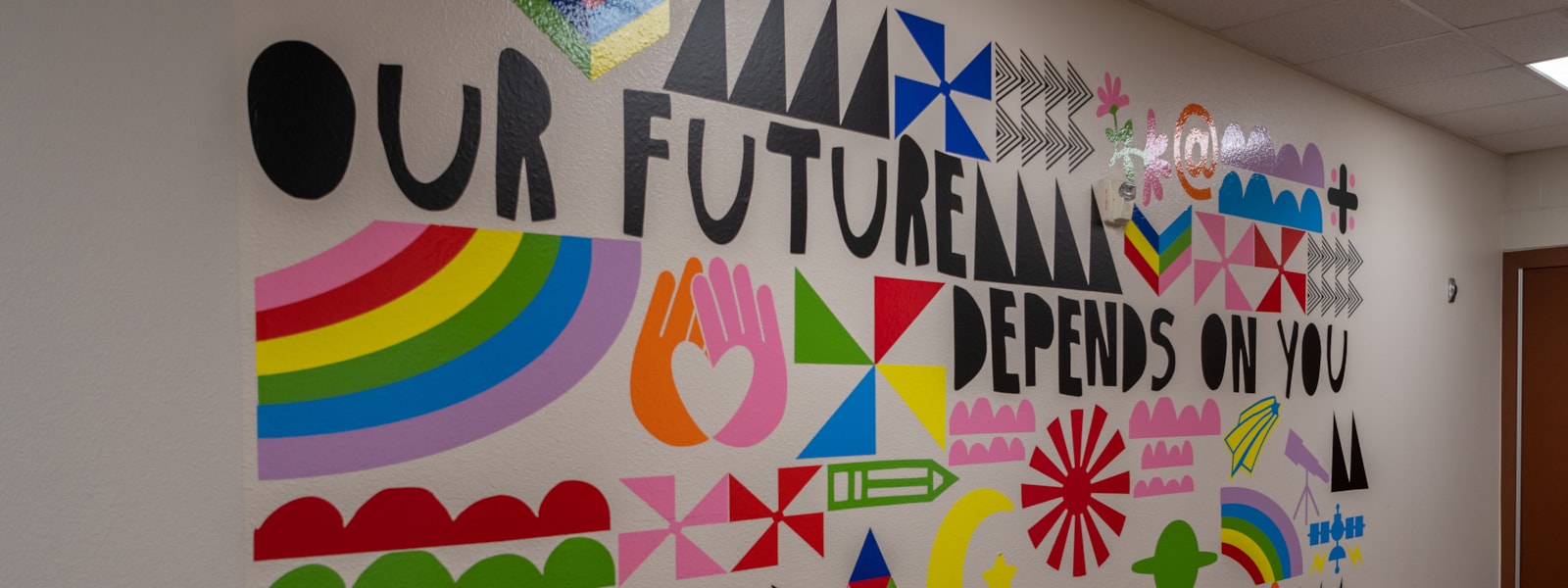 Our Future Depends On You Mural with colorful shapes