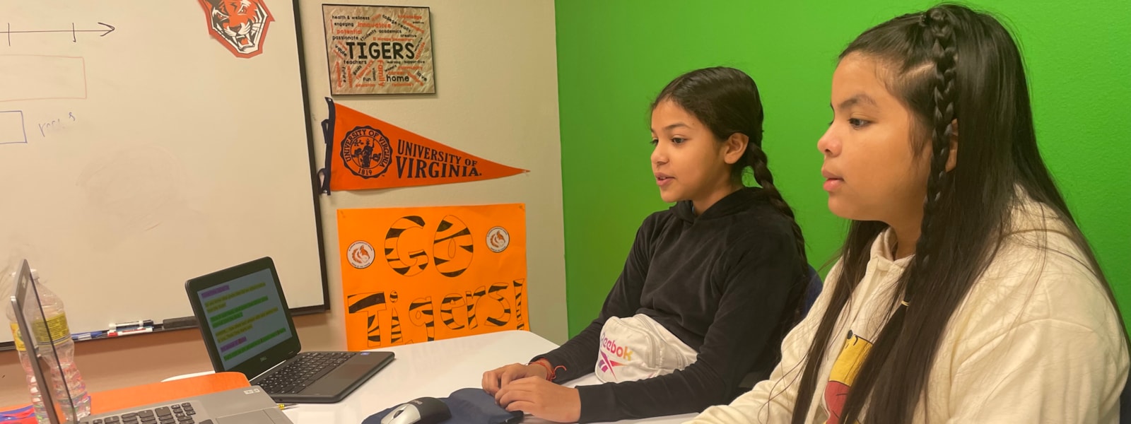 Two students recording the morning announcements.