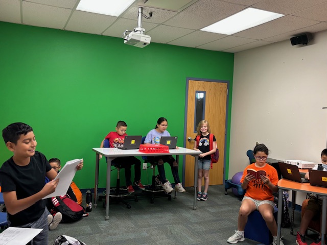 Students preparing morning announcements.