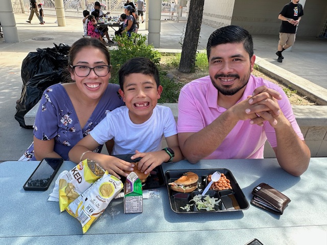 A family eating lunch.