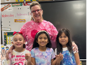 Students and teacher in Valentine spirit wear.