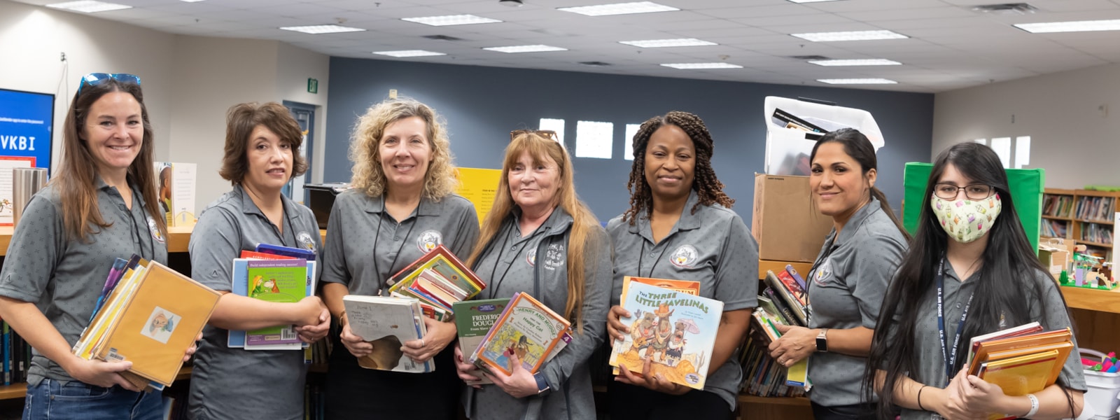 Volunteers sorting books in the library
