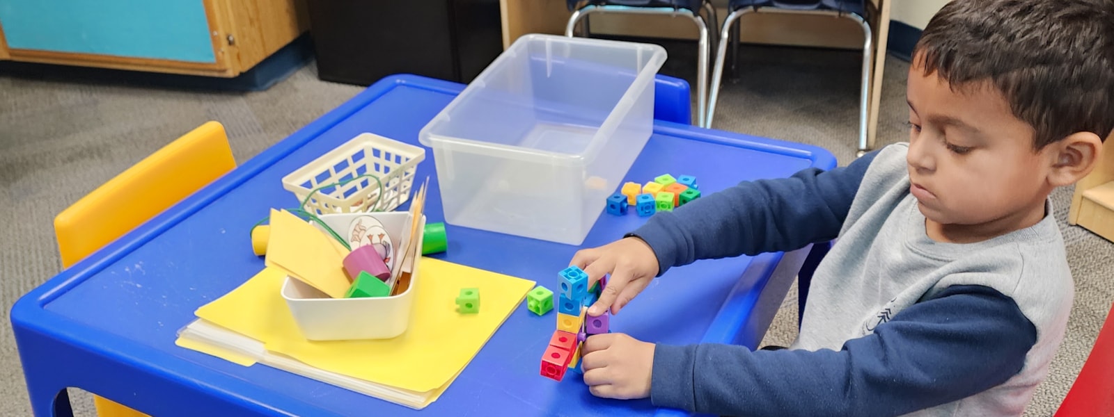 student playing with a toy