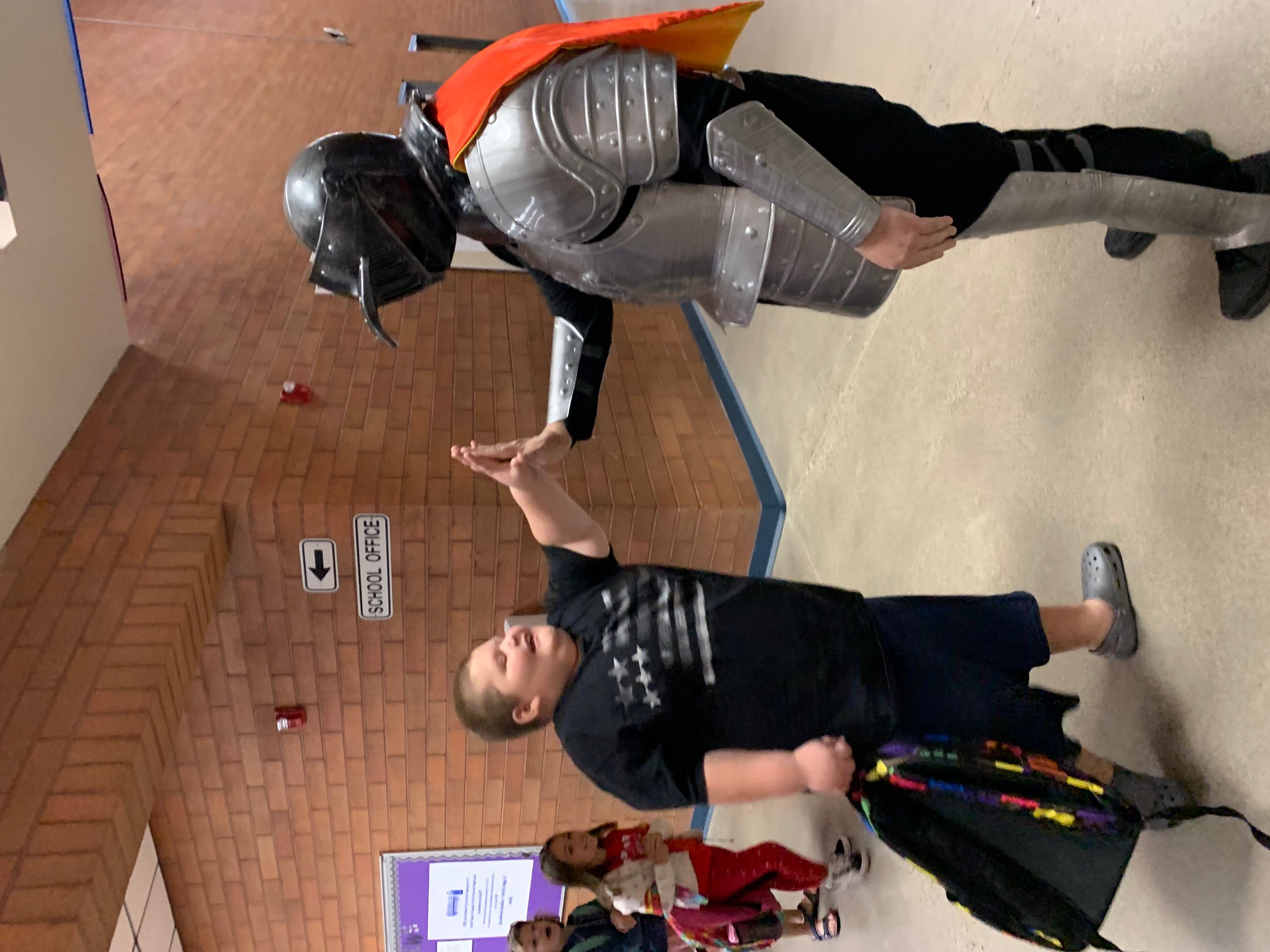 Kingswood's Knight high-fiving a student
