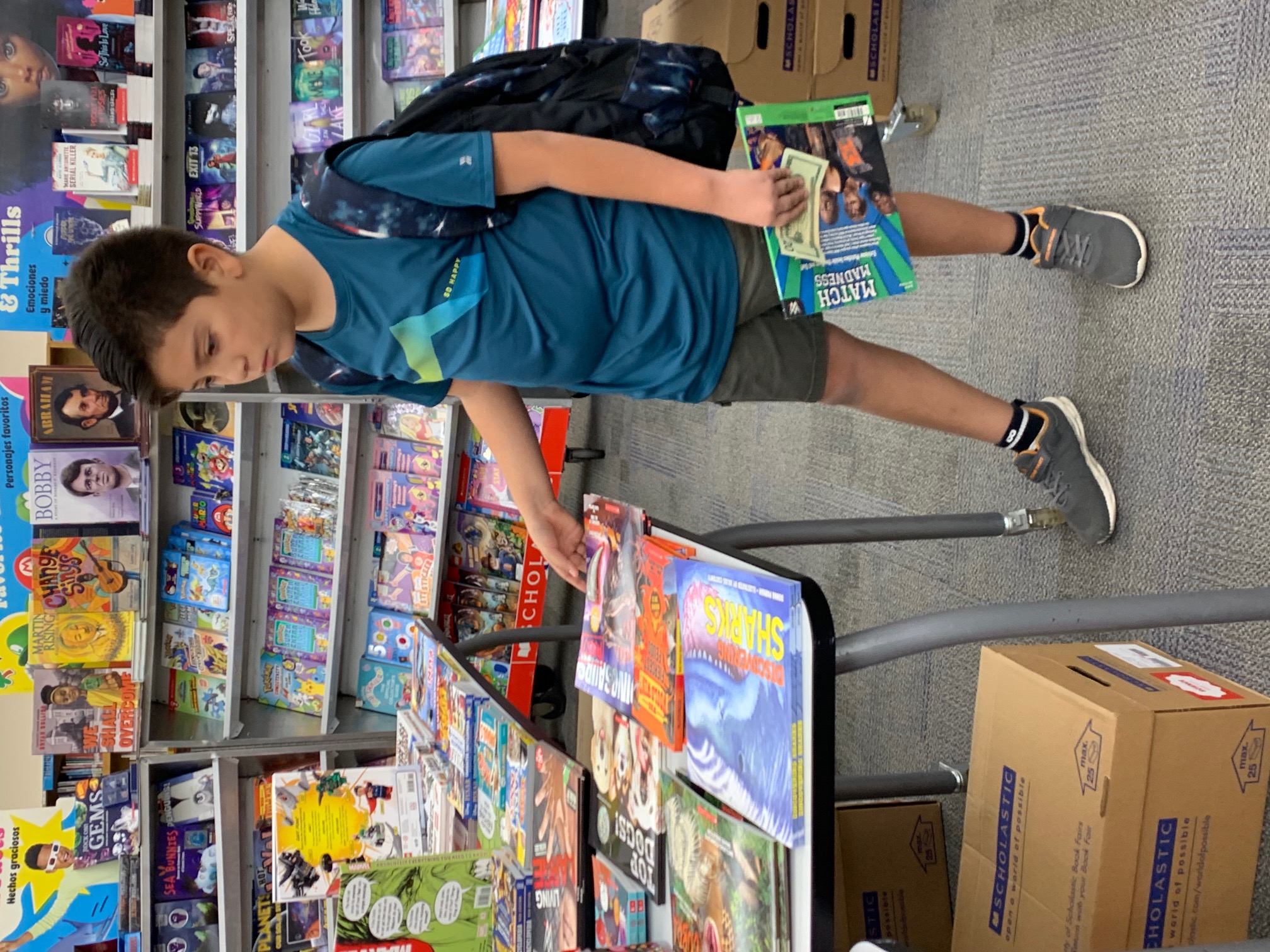 student looking at books