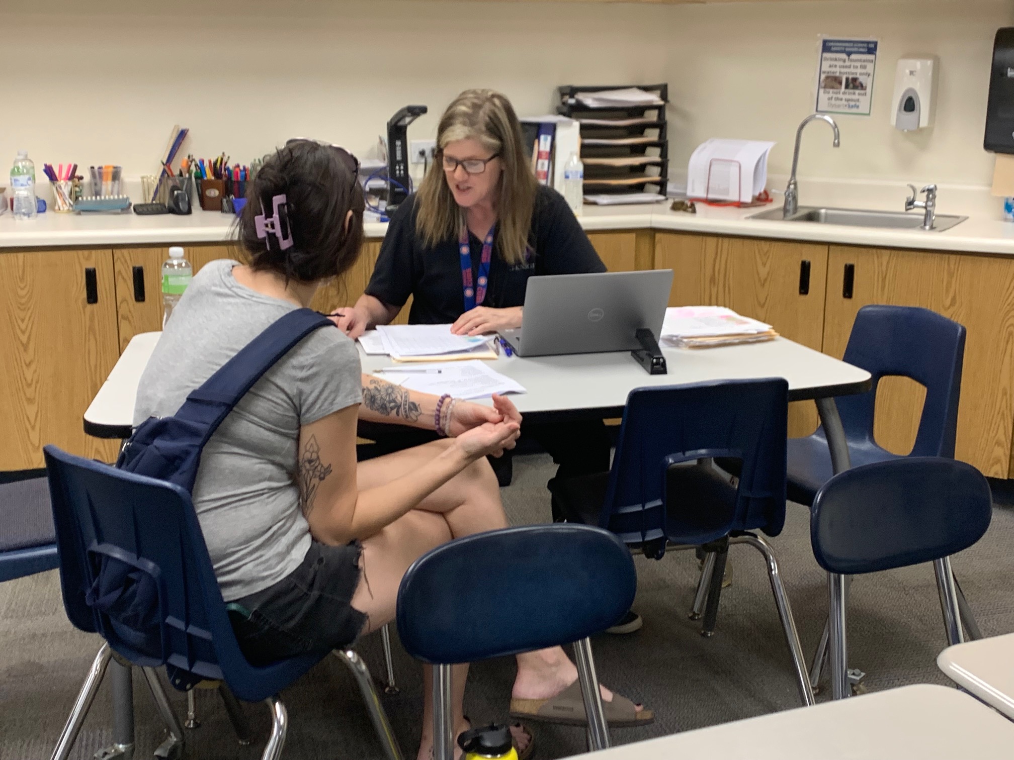 teacher meeting with student