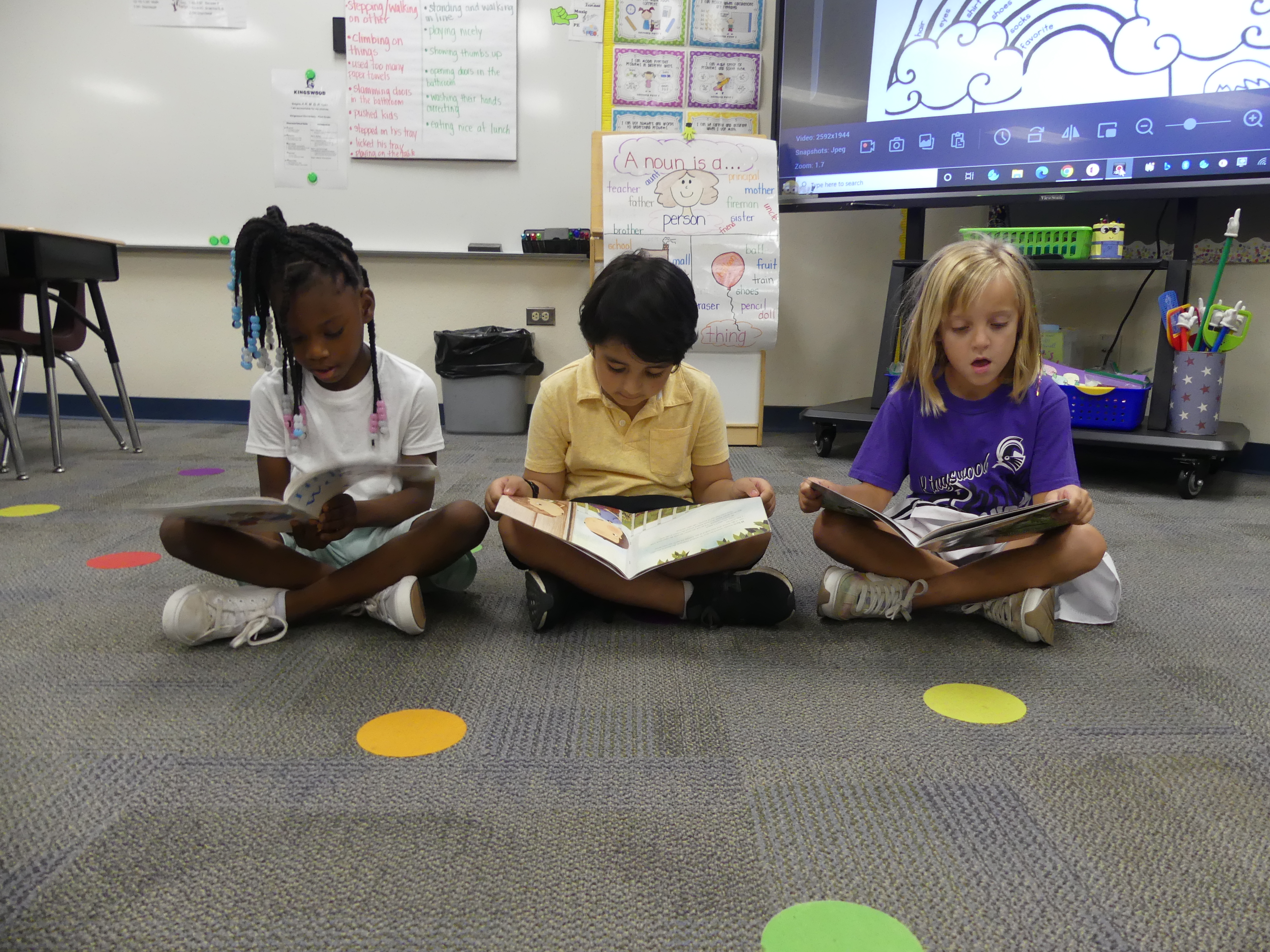 students reading a book