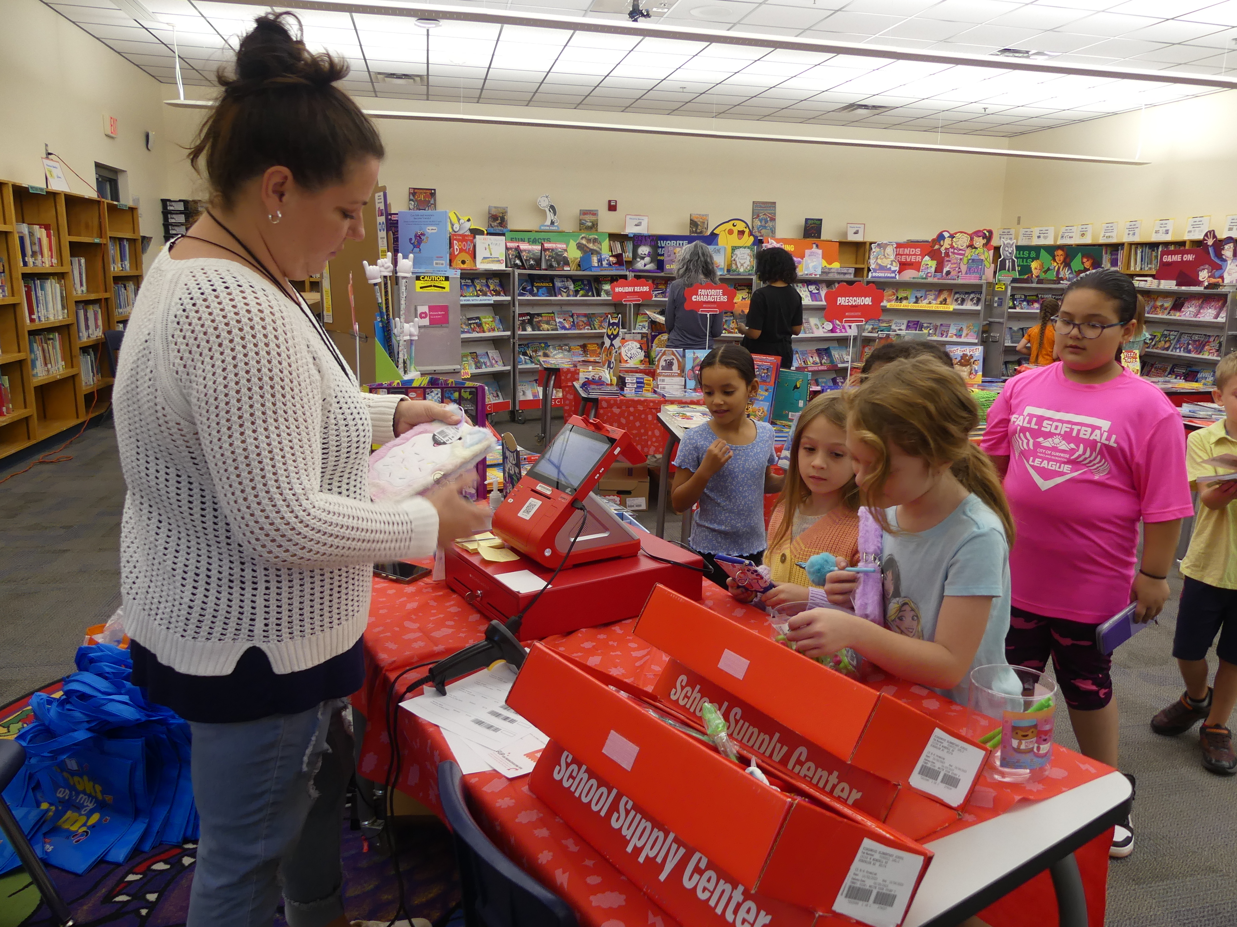 volunteer and students standing in a line