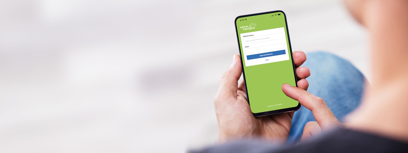 person's hand operating parent portal app on a phone.