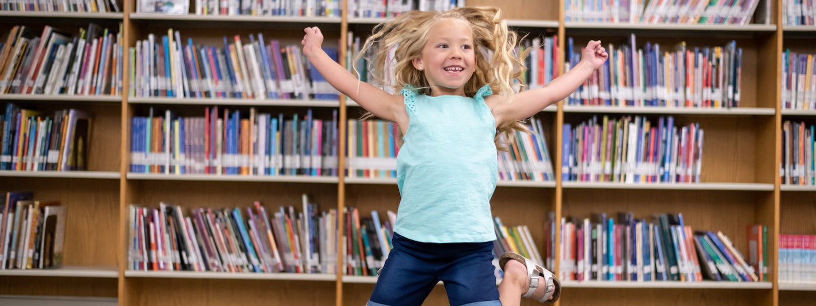 Student jumping excitedly for the 2023-2024 school year