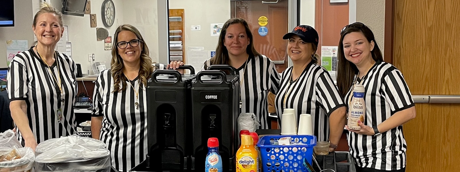 PTA ladies in referee shirts and a coffee cart