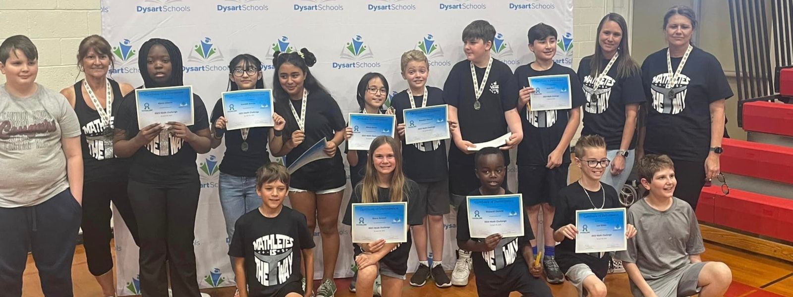Students holding certificates at the Mathletes competition