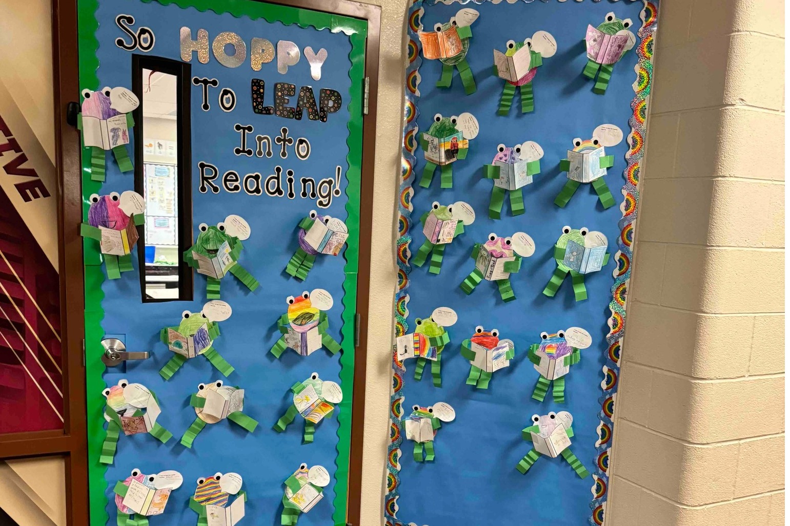 Door decorated with frogs reading books.