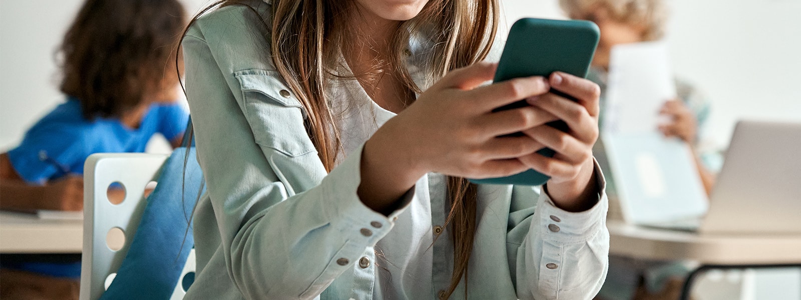 Student using a cell phone in class