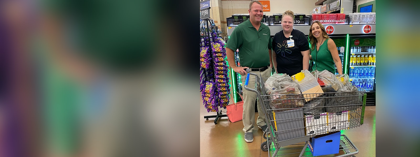 Mr. Griesel and Mrs. Hoppe accept a donation of school supplies