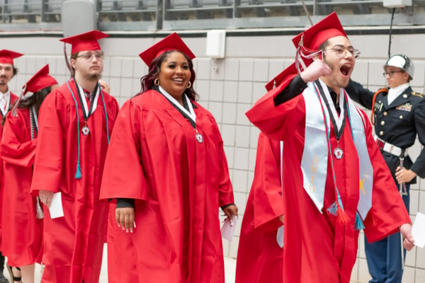 students walking into graduation