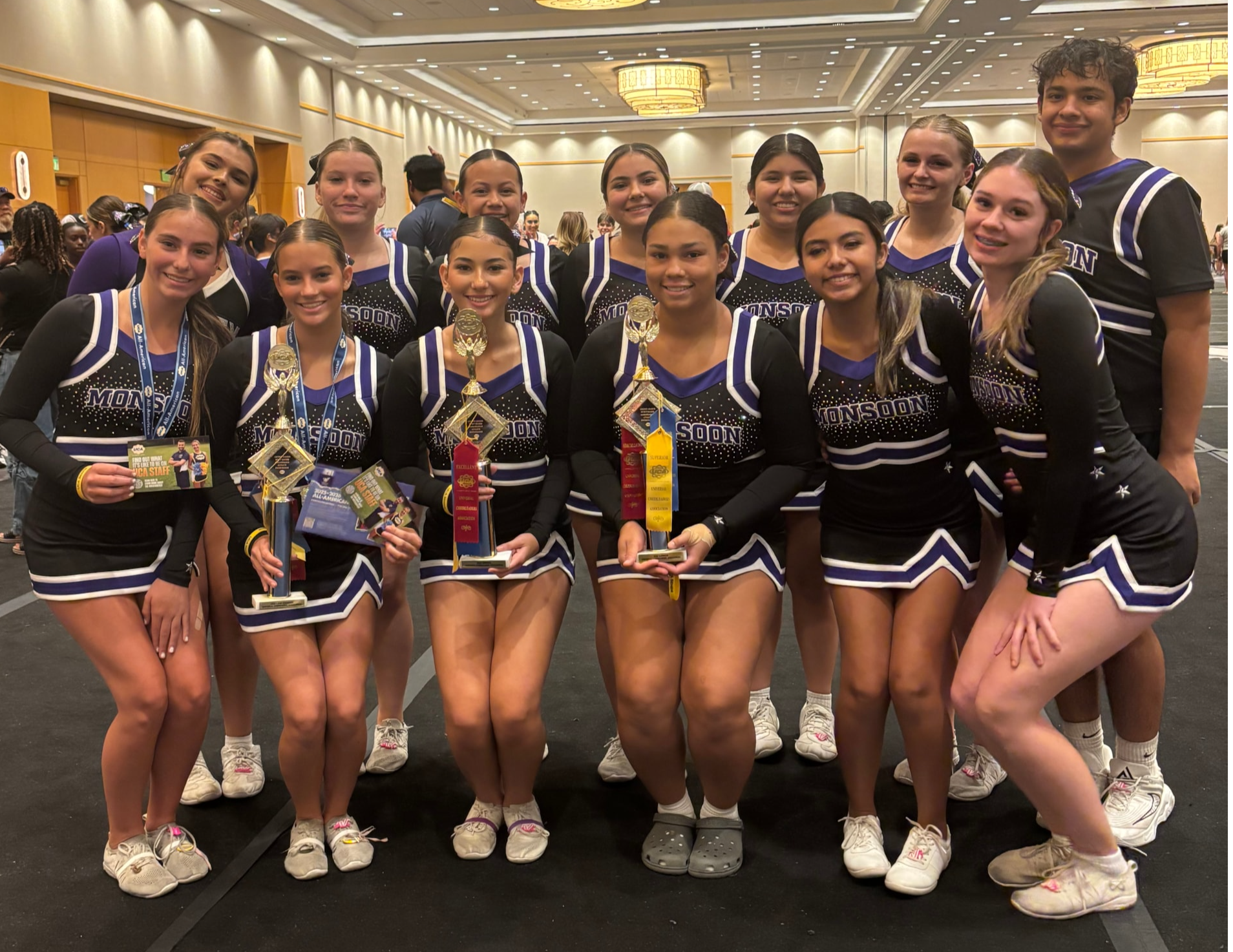 Cheerleaders with trophies at Cheer Camp