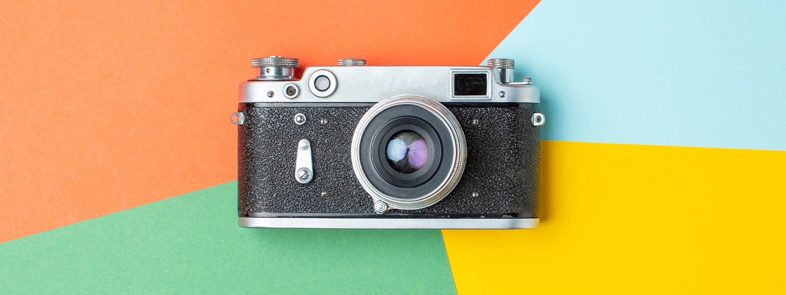 Camera on colorful background
