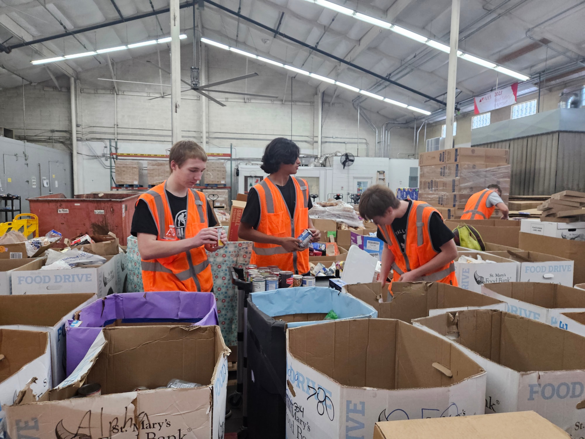 SRHS students assisting with sorting donated items at St. Mary's Food Bank