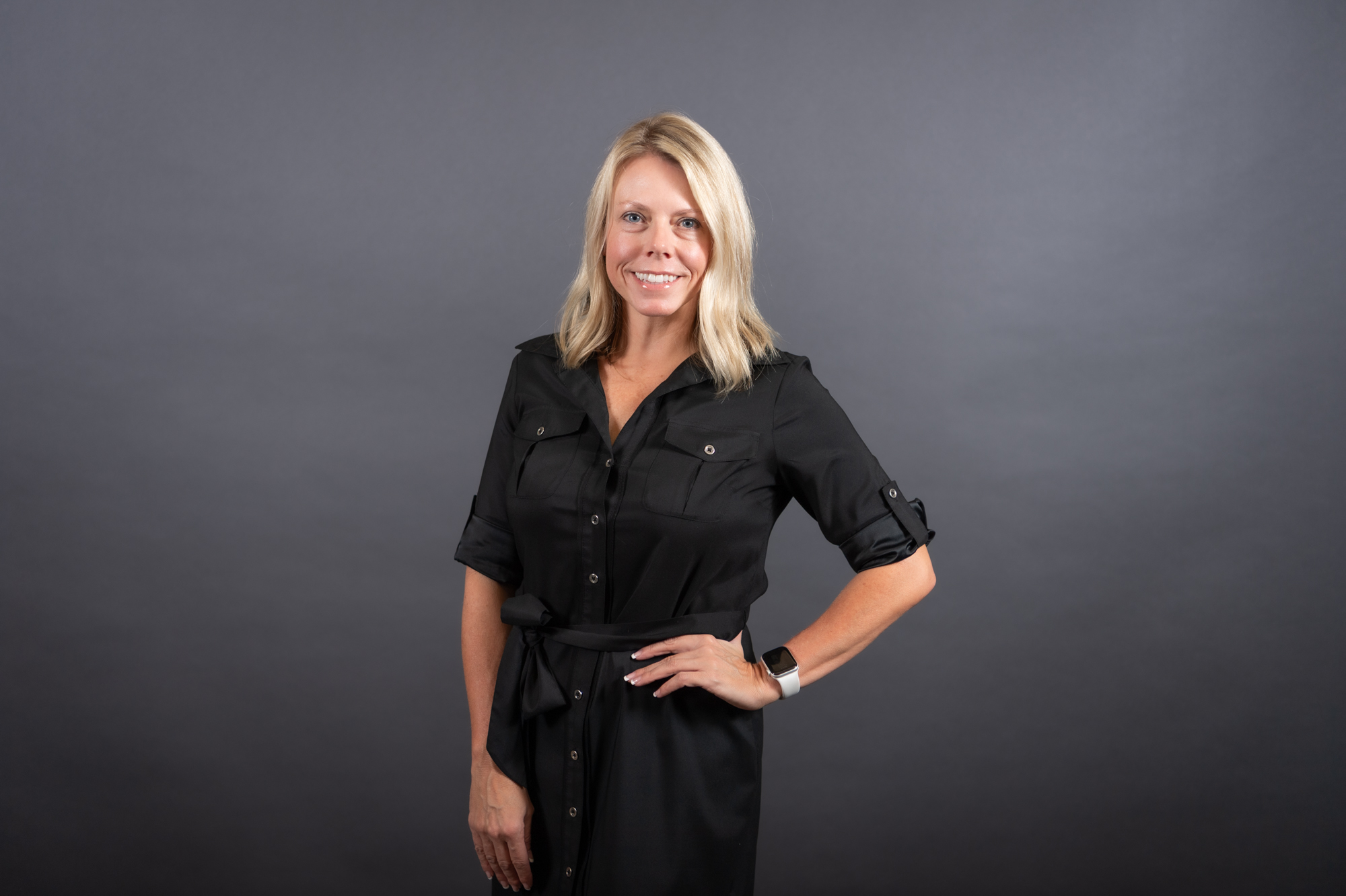 Amy Crow with black belted dress